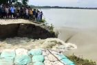 Agitated flood hit people cut opened an embankment to get respite from water logging